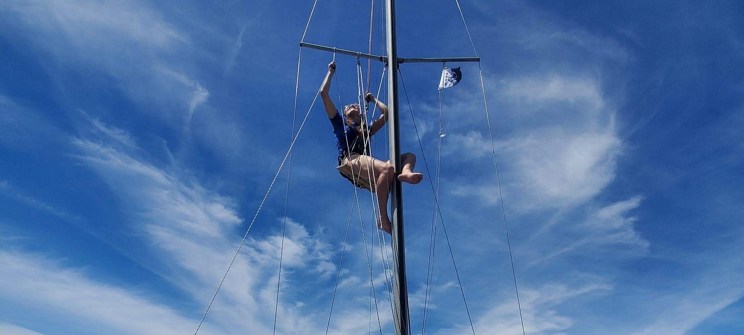 The author up in the riggings of a sailboat