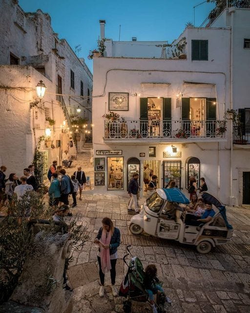 May be an image of 11 people and Santorini