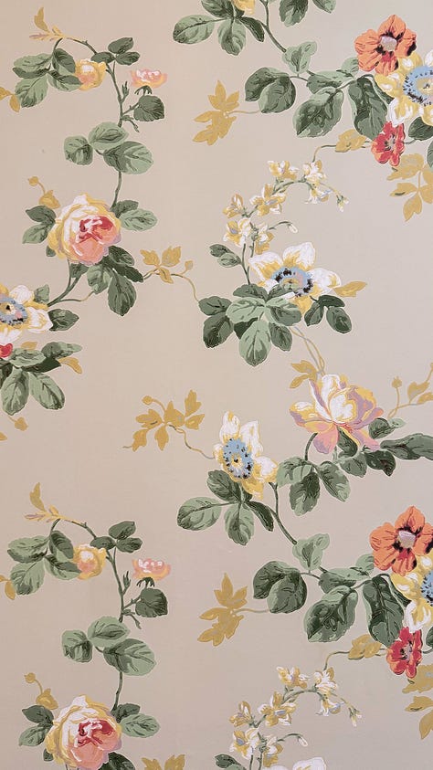 Closeup of wallpaper in the house - one of florals, one of woods, and one of yellow roses