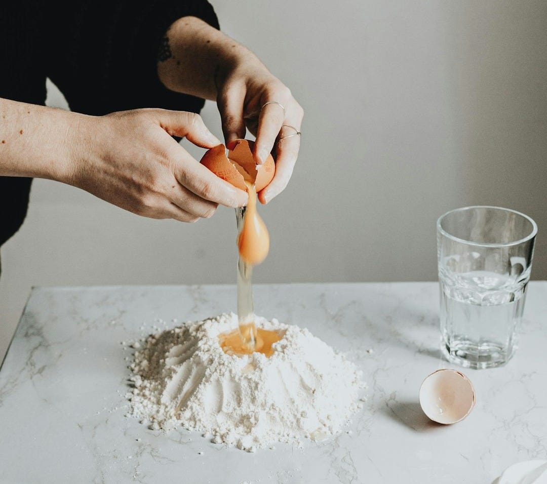 person holding a white cream