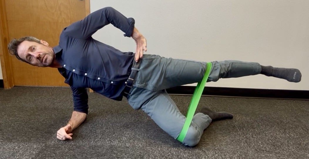 A man doing a lateral hip exercise A man doing a lateral hip exercise