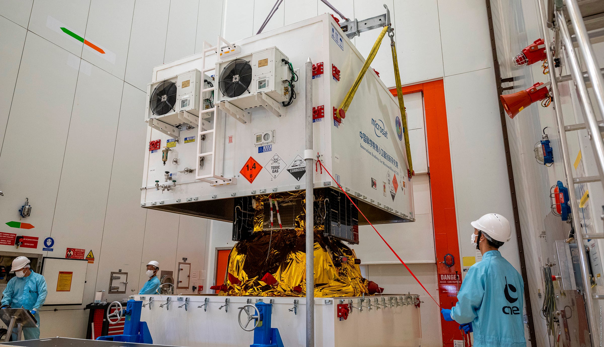 SMILE being unboxed from its transportation container inside a cleanroom at the Guiana Space Centre.