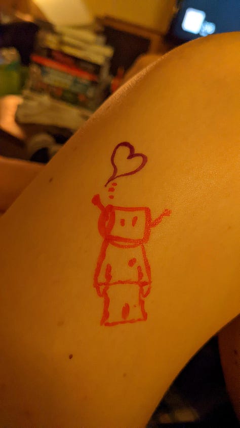 a cartoon robot drawn and painted on many surfaces.