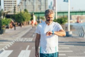 man walking with smartwatch