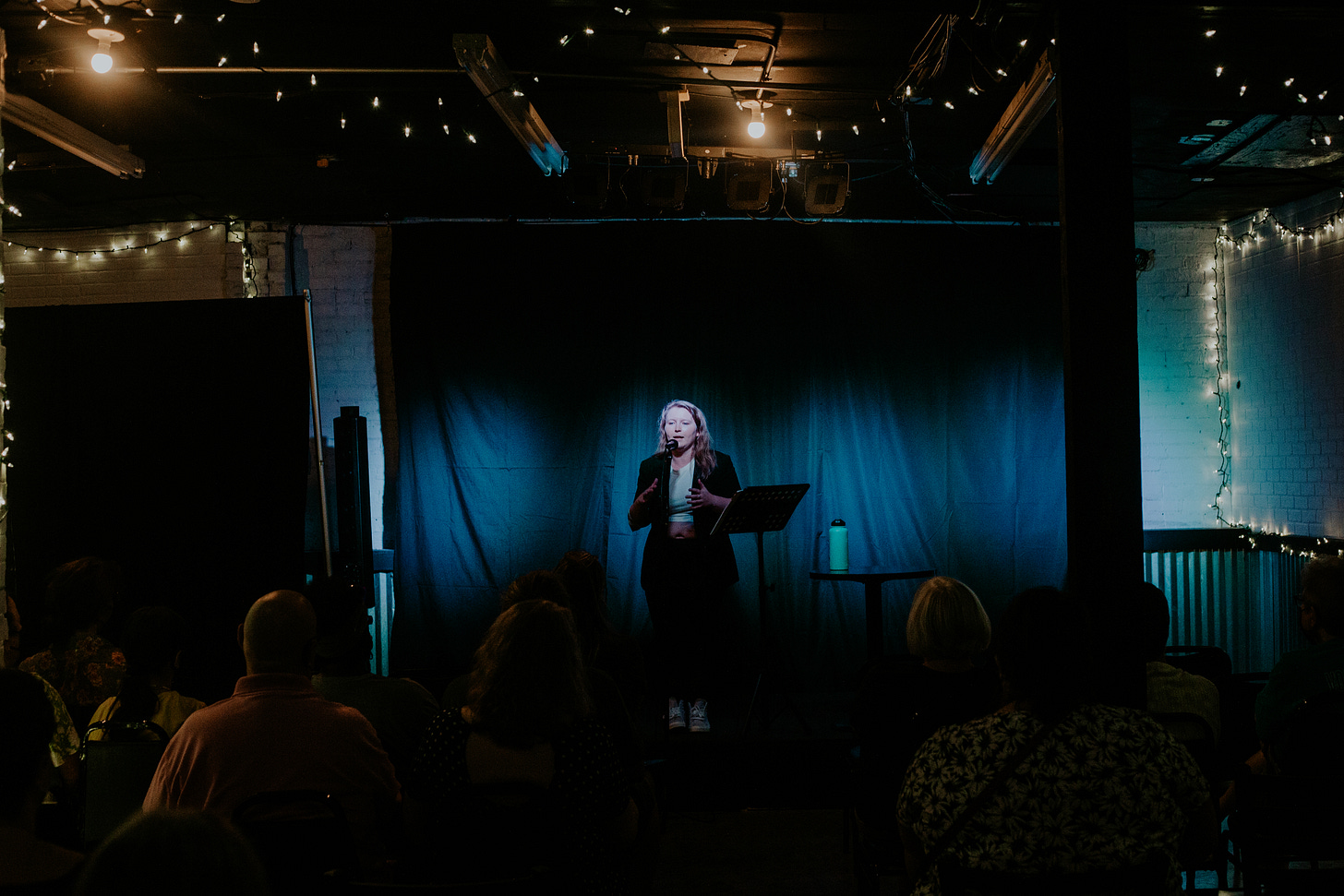 Abby Bland performing on stage in front of an audience
