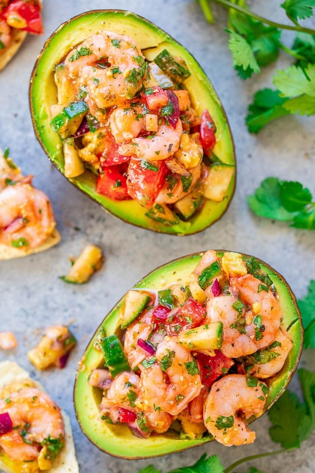 Shrimp Stuffed Avocados - If you like ceviche, you're going to LOVE these EASY avocados stuffed with a mixture of shrimp, tomatoes, cucumber, red onions, and more - plus some hot sauce for a touch of heat!! There's a time-saving shortcut so these are ready in 15 minutes with no fuss!! Shrimp Stuffed Avocados - If you like ceviche, you're going to LOVE these EASY avocados stuffed with a mixture of shrimp, tomatoes, cucumber, red onions, and more - plus some hot sauce for a touch of heat!! There's a time-saving shortcut so these are ready in 15 minutes with no fuss!!