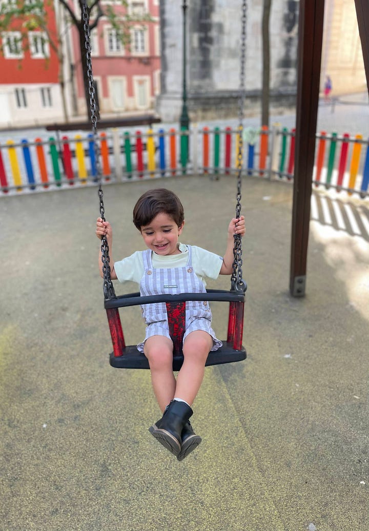 Images of a young child on a swing and slide