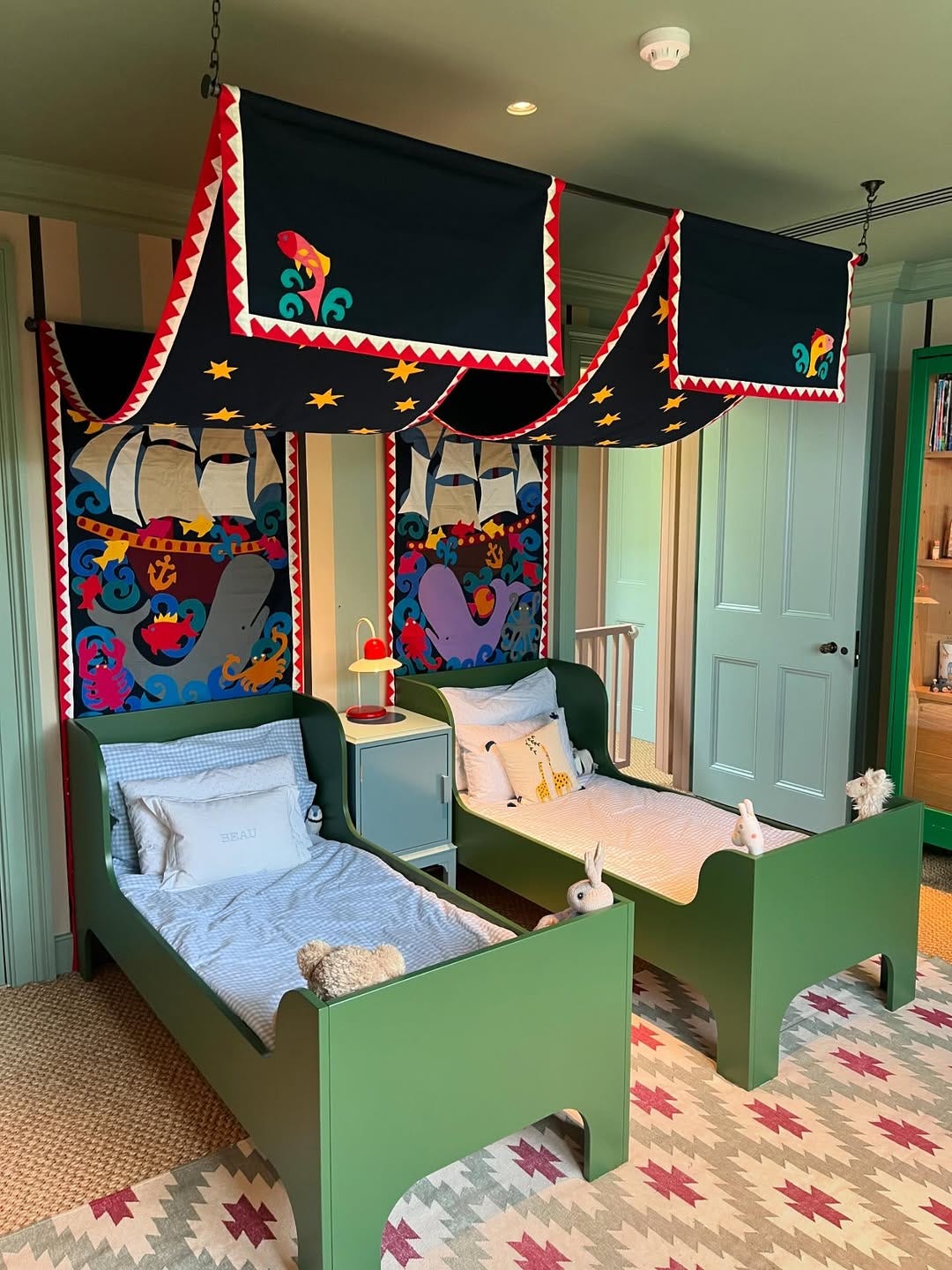 Children's beds with bright canopies using Joanna's banners