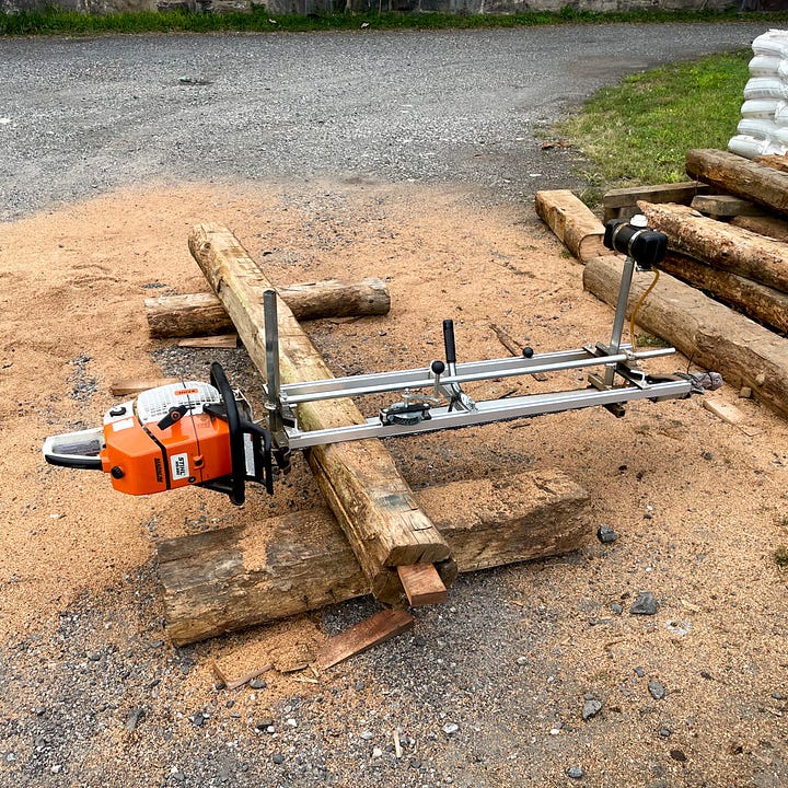 An image of Pearl and Soren in the new barn and an image of the saw mill used to make doors out of an American Chestnut tree.