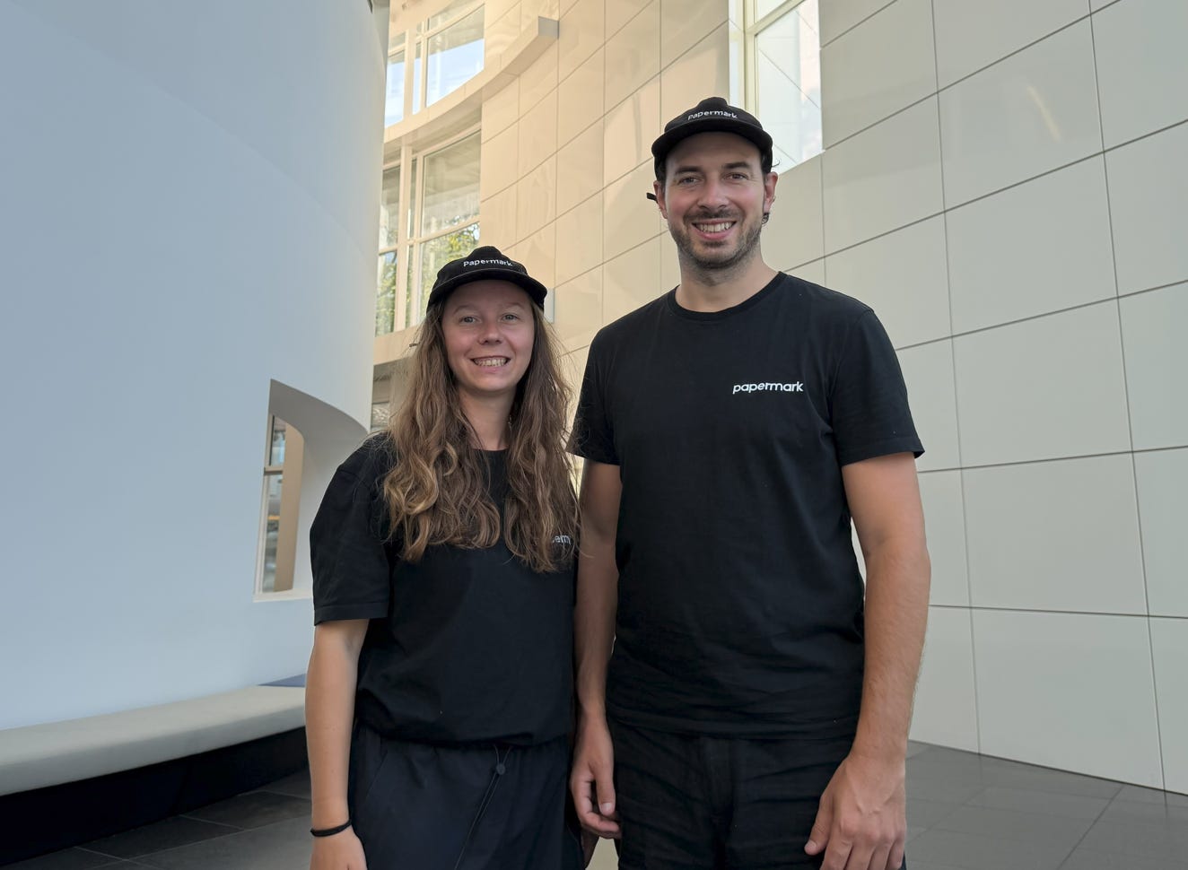 Iuliia Shnai wearing a Papermark cap, seated in an open-plan office, with co-founder Marc working on a laptop in the background. The two founders of Papermark, the secure pitch deck sharing and data room platform behind the 2026 Fundraising Report. Iuliia Shnai wearing a Papermark cap, seated in an open-plan office, with co-founder Marc working on a laptop in the background. The two founders of Papermark, the secure pitch deck sharing and data room platform behind the 2026 Fundraising Report.