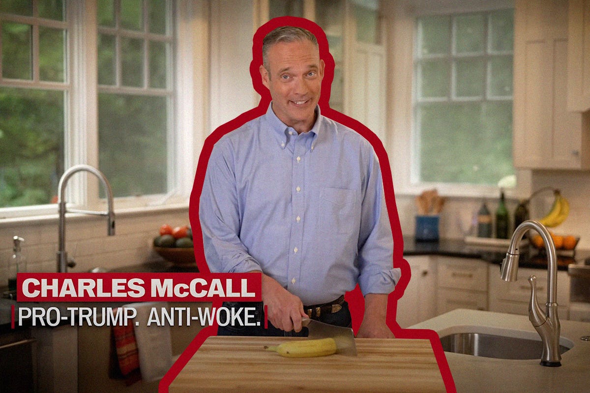 This is a screenshot from Charles McCall's campaign video featuring him chopping a banana in half looking at the camera with a grin.