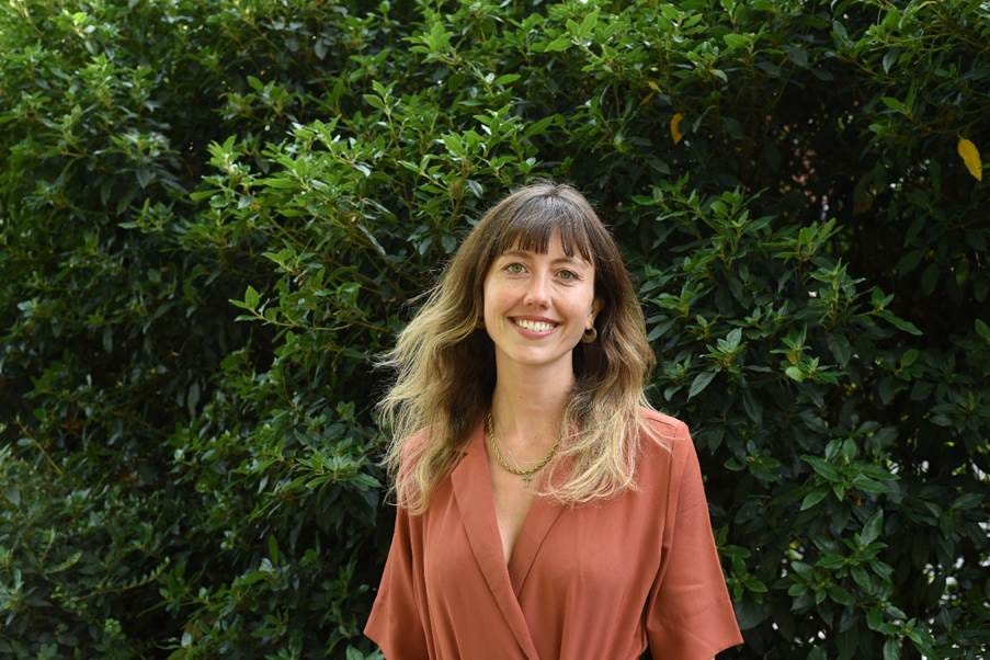 A person smiling in front of a bush
AI-generated content may be incorrect. A person smiling in front of a bush
AI-generated content may be incorrect.