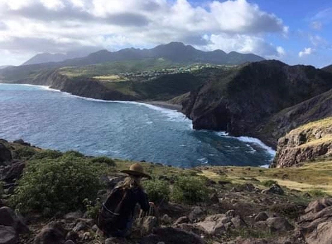 A view toward the village of Look Out in Montserrat.  A new village built in 1998,  funded by OECS, UK Aid and CAICOM to provide new homes for Montserratians who lost everything in the eruptions of 1997 - my Dad was one such person. This photo was taken by me while location scouting for the movie Wendy 2017.                                              It's a reminder of hope, resilience and regeneration.