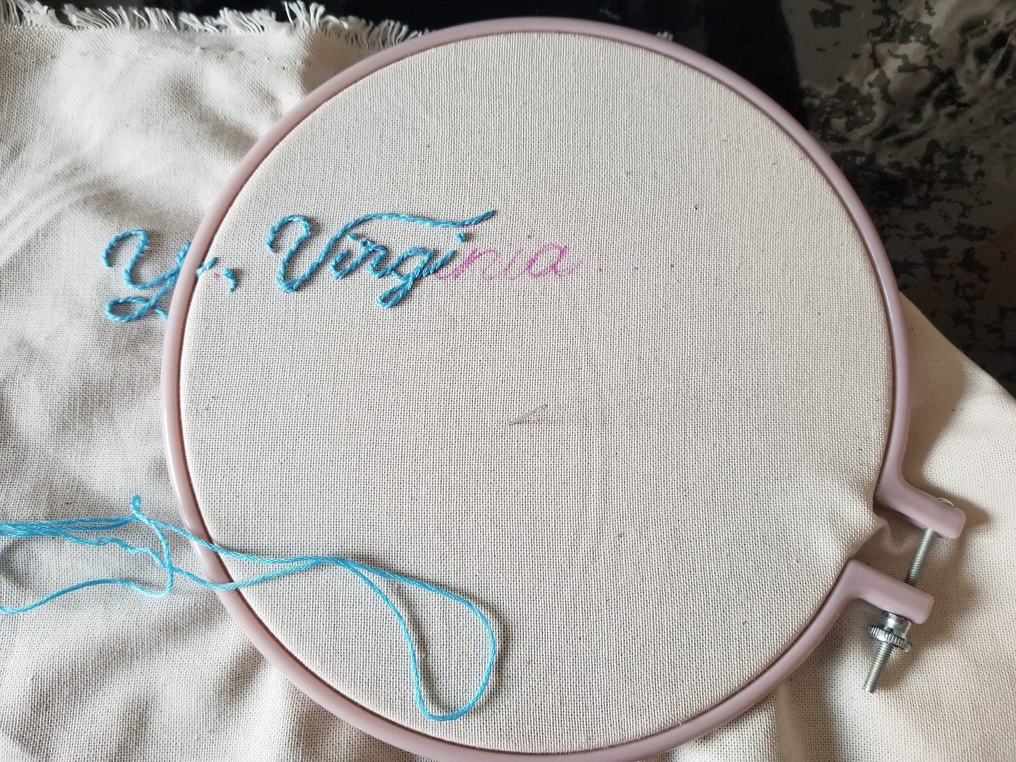 embroidery hoop with work in progress, letters Yes, Virginia