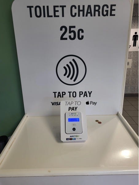 A white rectangular device with a screen on it

Description automatically generated