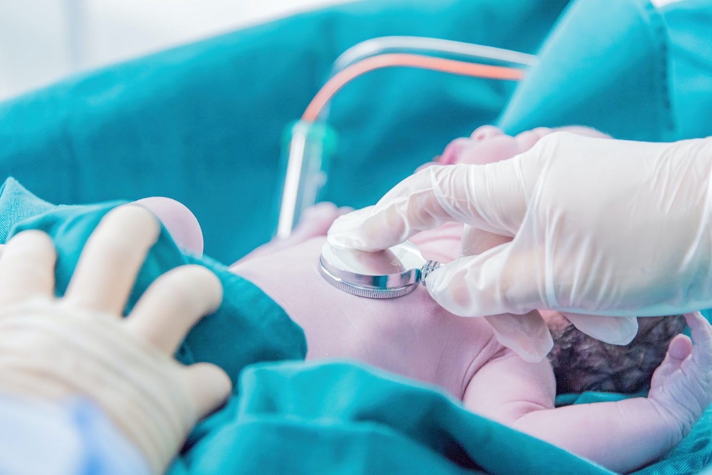 picture of newborn checkup in a medical setting