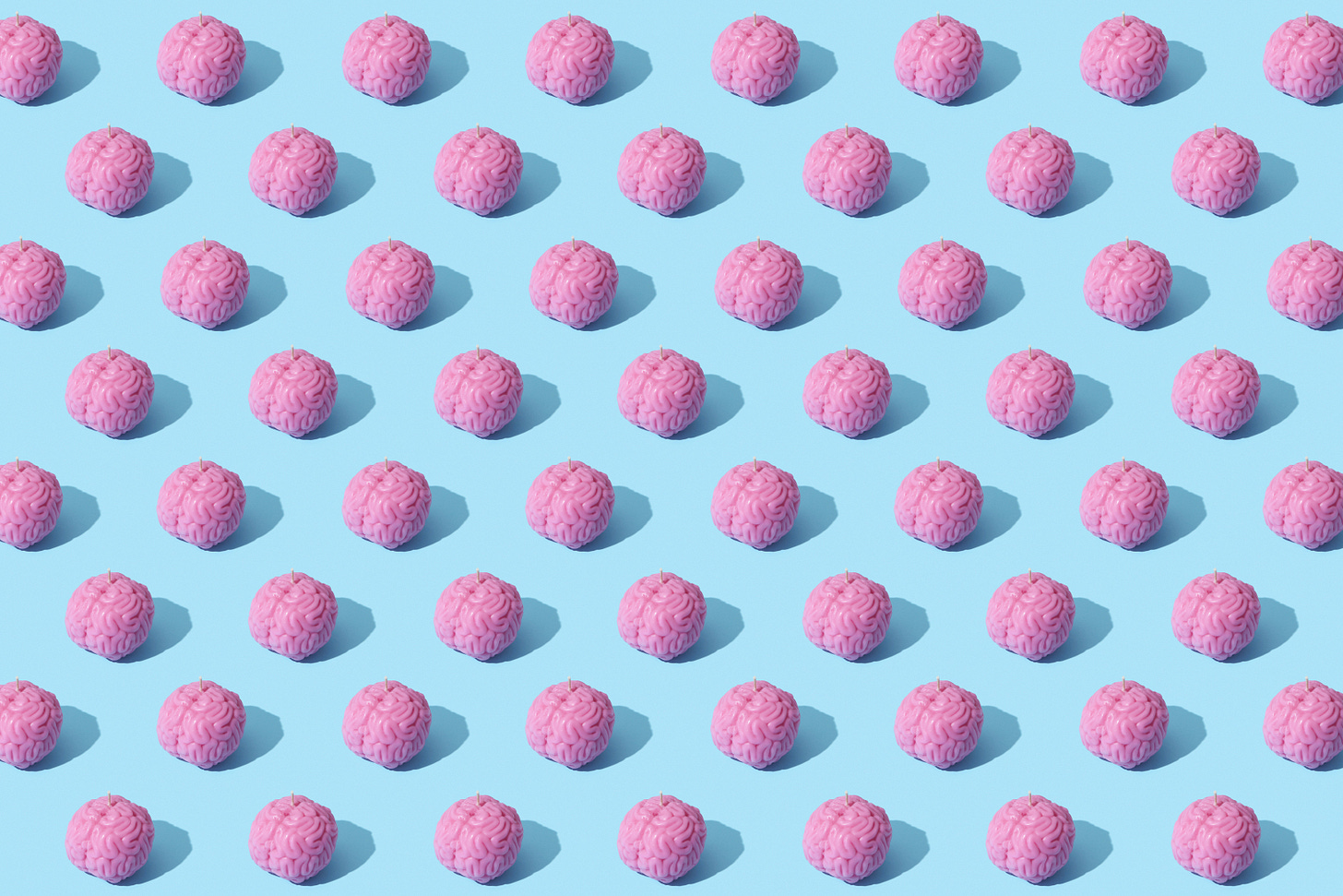 50-70 pink brains tiled on a pale blue background