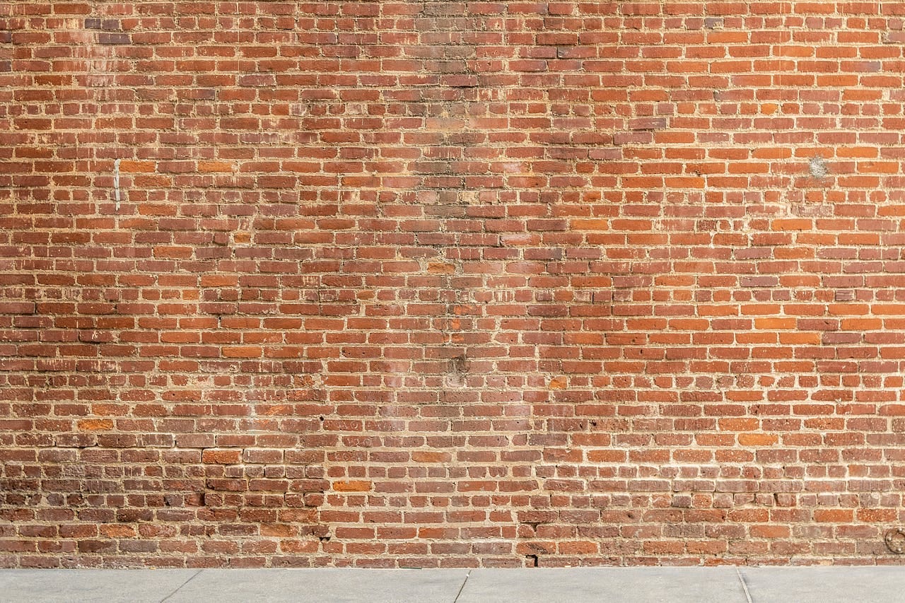 Photo by ShonEjai: https://www.pexels.com/photo/brown-brick-wall-1227515/