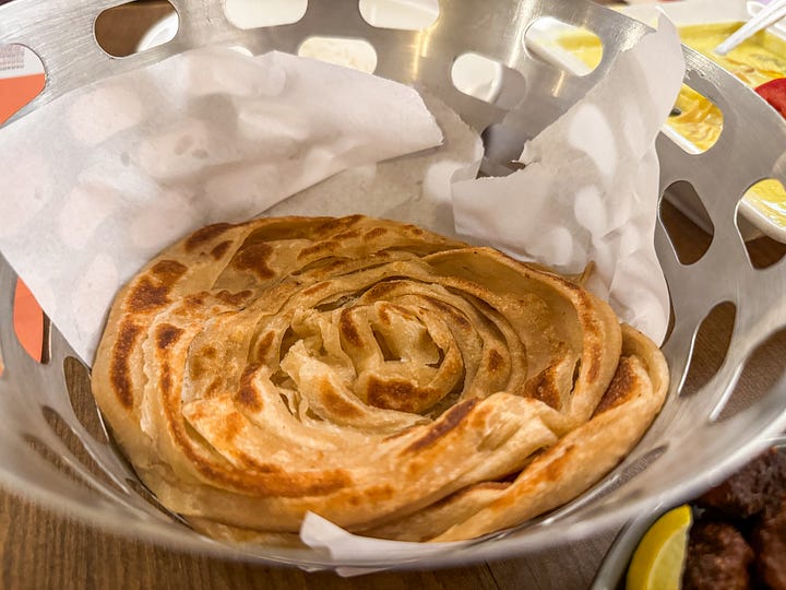 L-R: Beef Fry with a lime wedge and wheat porotta