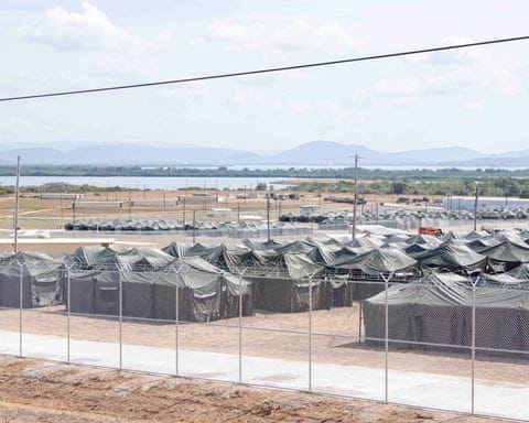 a large expanse of grey tents a large expanse of grey tents