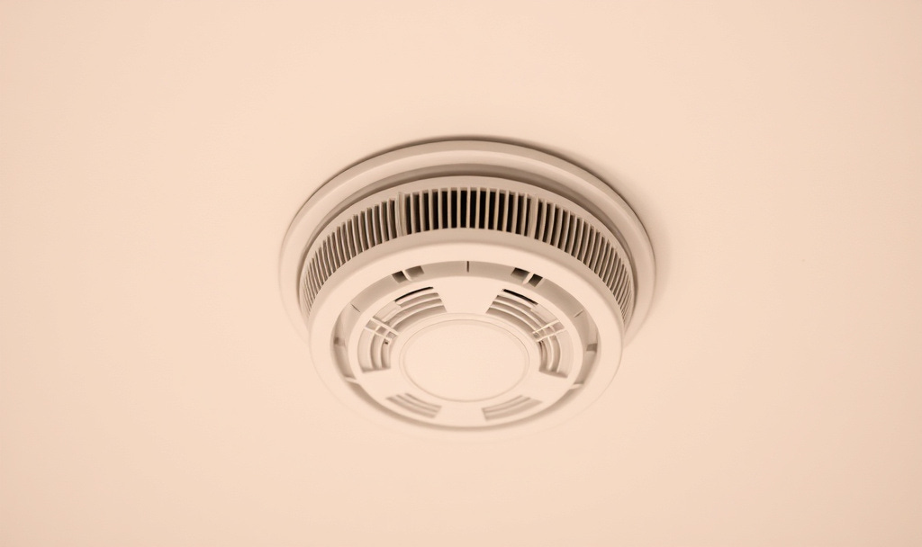 Smoke alarm on the ceiling.