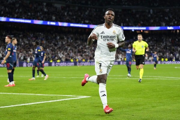 Vinícius Júnior reaches 100 goals with Real Madrid as club advances in  Champions League | AP News
