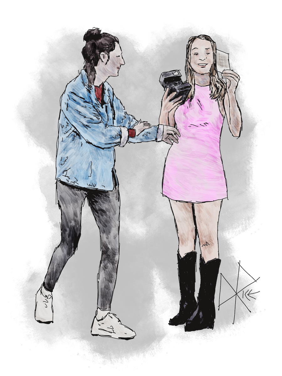 A woman holds a Polaroid instant camera in one hand and the photo it has just ejected in the other, as another woman excitedly moves in to see what has been captured. Sketch art by Don Rice. A woman holds a Polaroid instant camera in one hand and the photo it has just ejected in the other, as another woman excitedly moves in to see what has been captured. Sketch art by Don Rice.