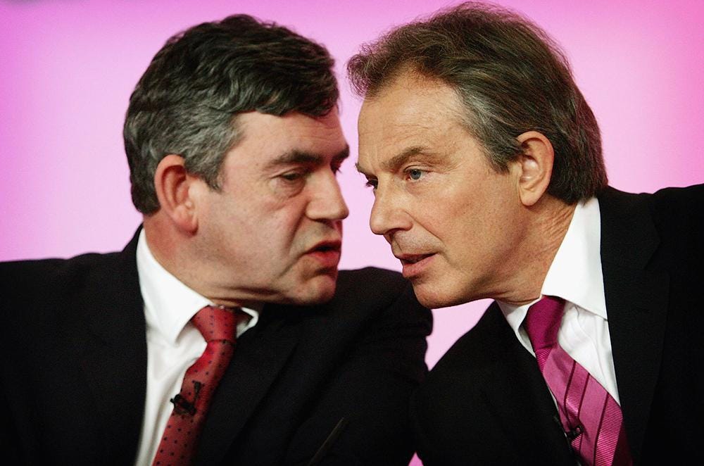 A close-up of men in suits

Description automatically generated