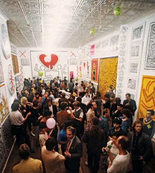 This may contain: a large group of people standing in a room with paintings on the walls and ceiling