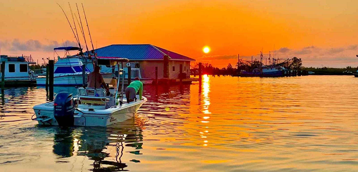 Boating Up to Sportsman's Lodge at Sunset
