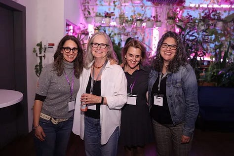 Meghan Daum hosting an Unspeakeasy retreat weekend in New York City with attendees in conversation around a table