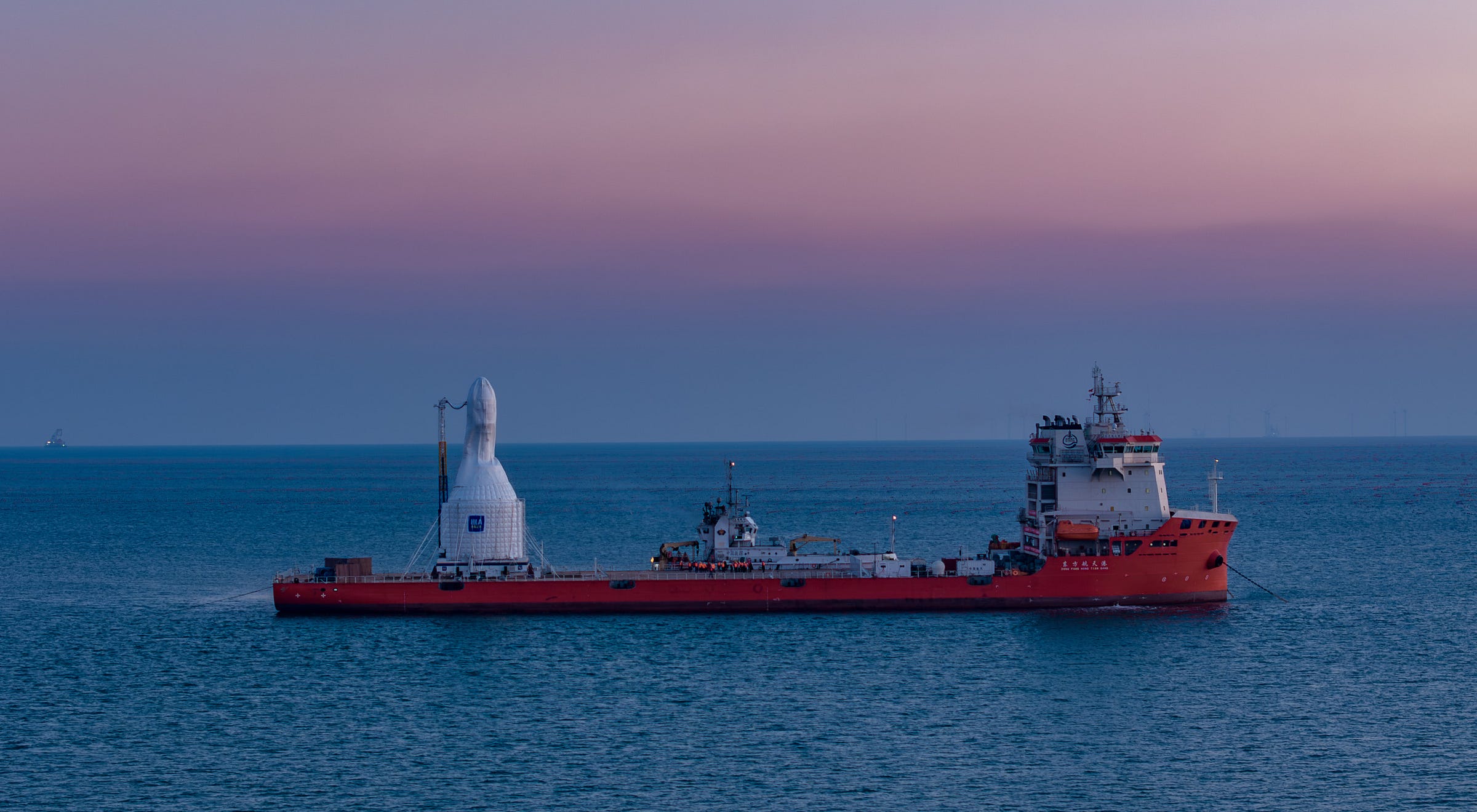 Orienspace’s Gravity-1 Y1 vehicle under a protective cover onboard its sea-launch platform in the Yellow Sea ahead of its debut flight. Orienspace’s Gravity-1 Y1 vehicle under a protective cover onboard its sea-launch platform in the Yellow Sea ahead of its debut flight.