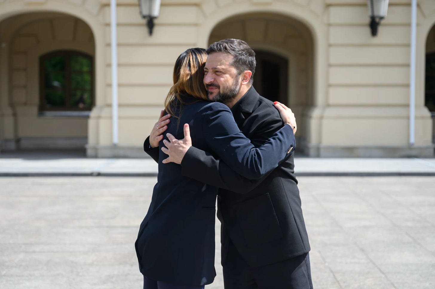 Laura Loomer hugs Ukrainian President Volodymyr Zelenskyy.