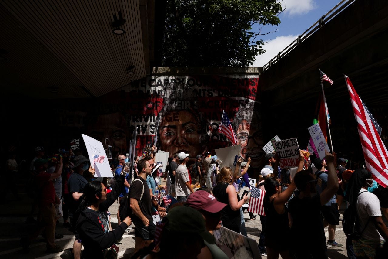 People participate in a "No Kings" rally in Atlanta on Saturday.