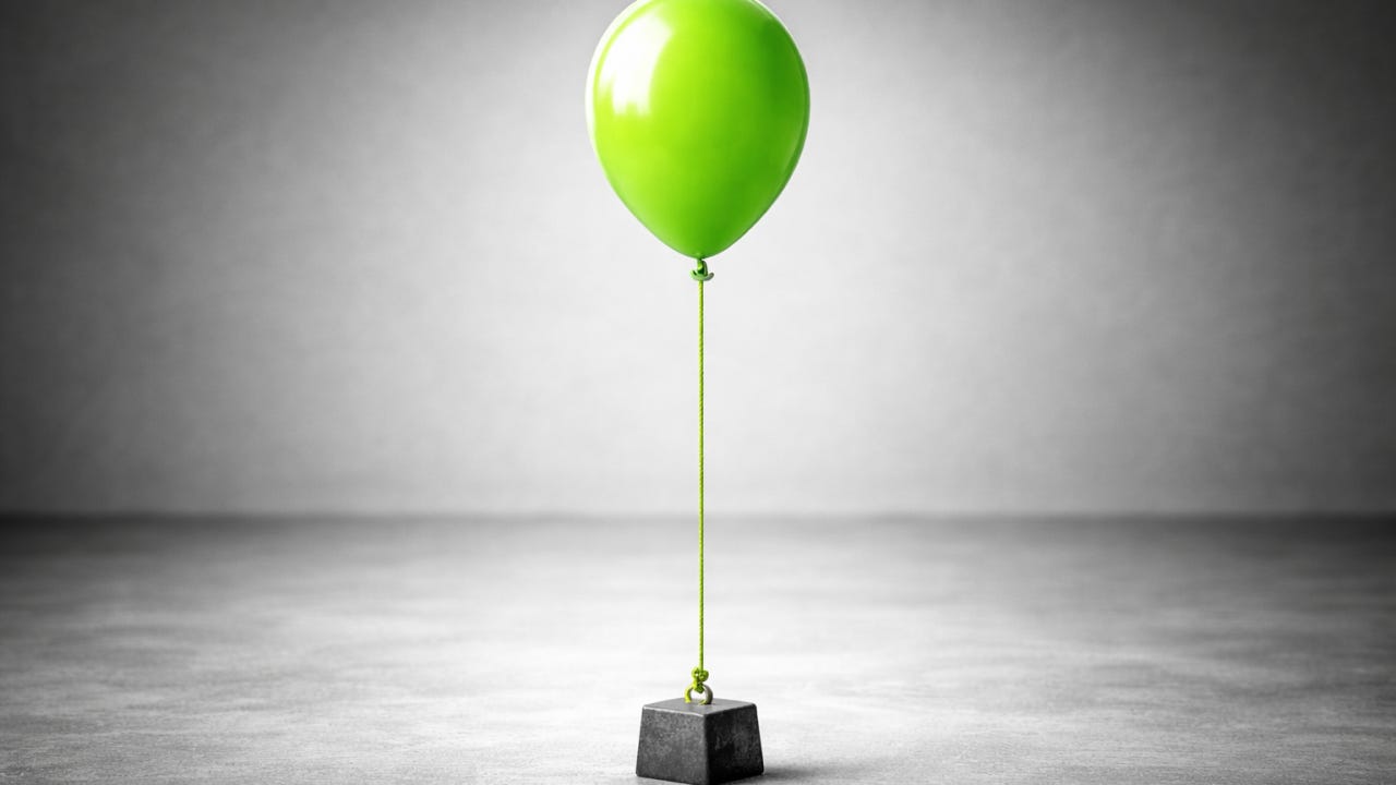 A green balloon tied to a heavy weight, illustrating how fixed burn and premature hiring can create organizational drag and restrict B2B go-to-market growth. A green balloon tied to a heavy weight, illustrating how fixed burn and premature hiring can create organizational drag and restrict B2B go-to-market growth.