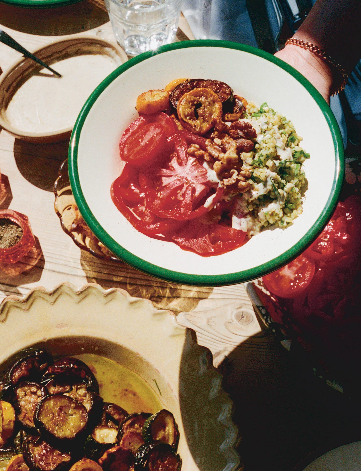 Plate of eggplant, tomato, bulgur salad.