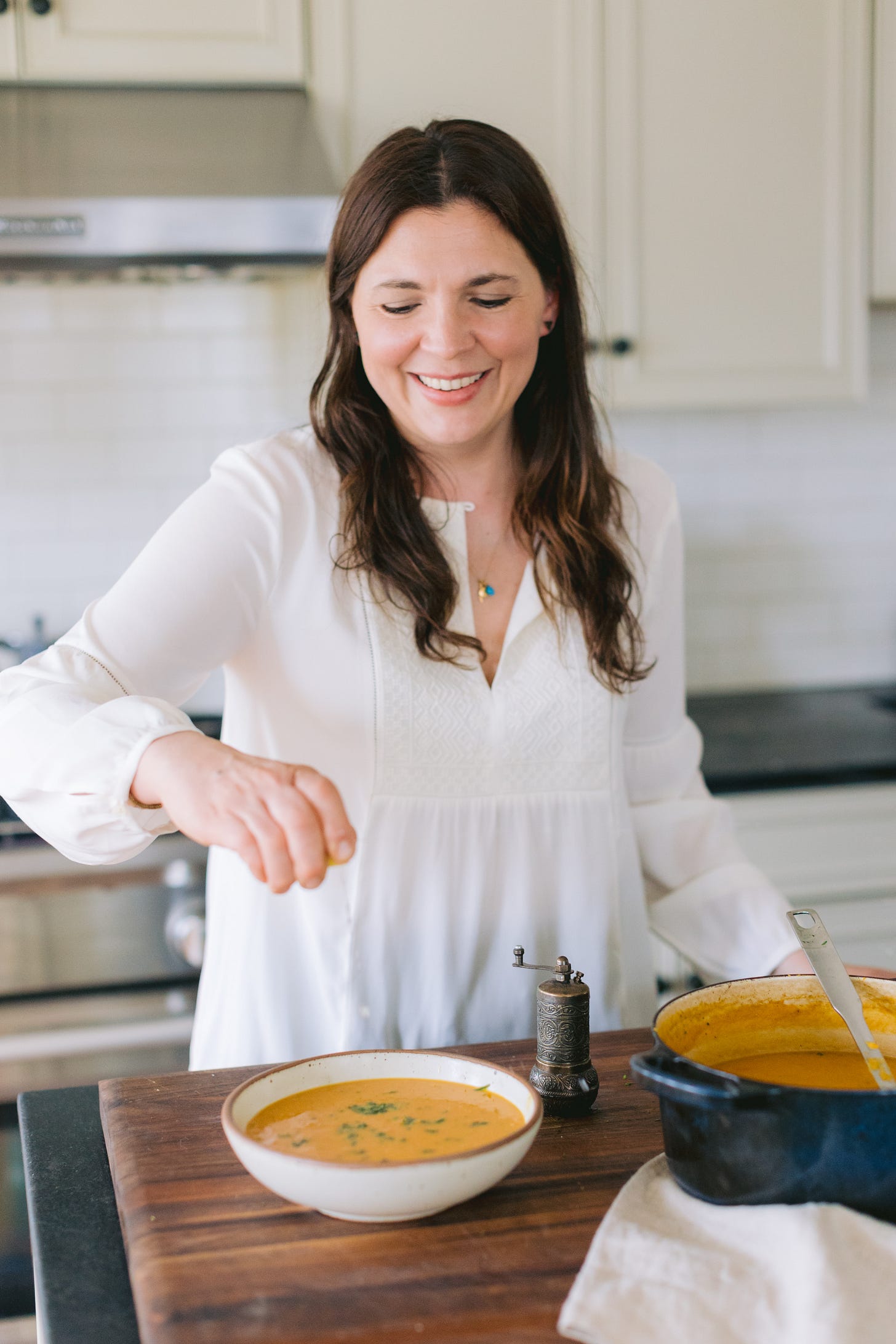 Lauren Kretzer adding finishing touches to a bowl of soup Lauren Kretzer adding finishing touches to a bowl of soup