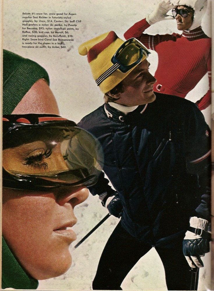 This may contain: an advertisement for ski wear featuring two skiers and one is wearing goggles on their head