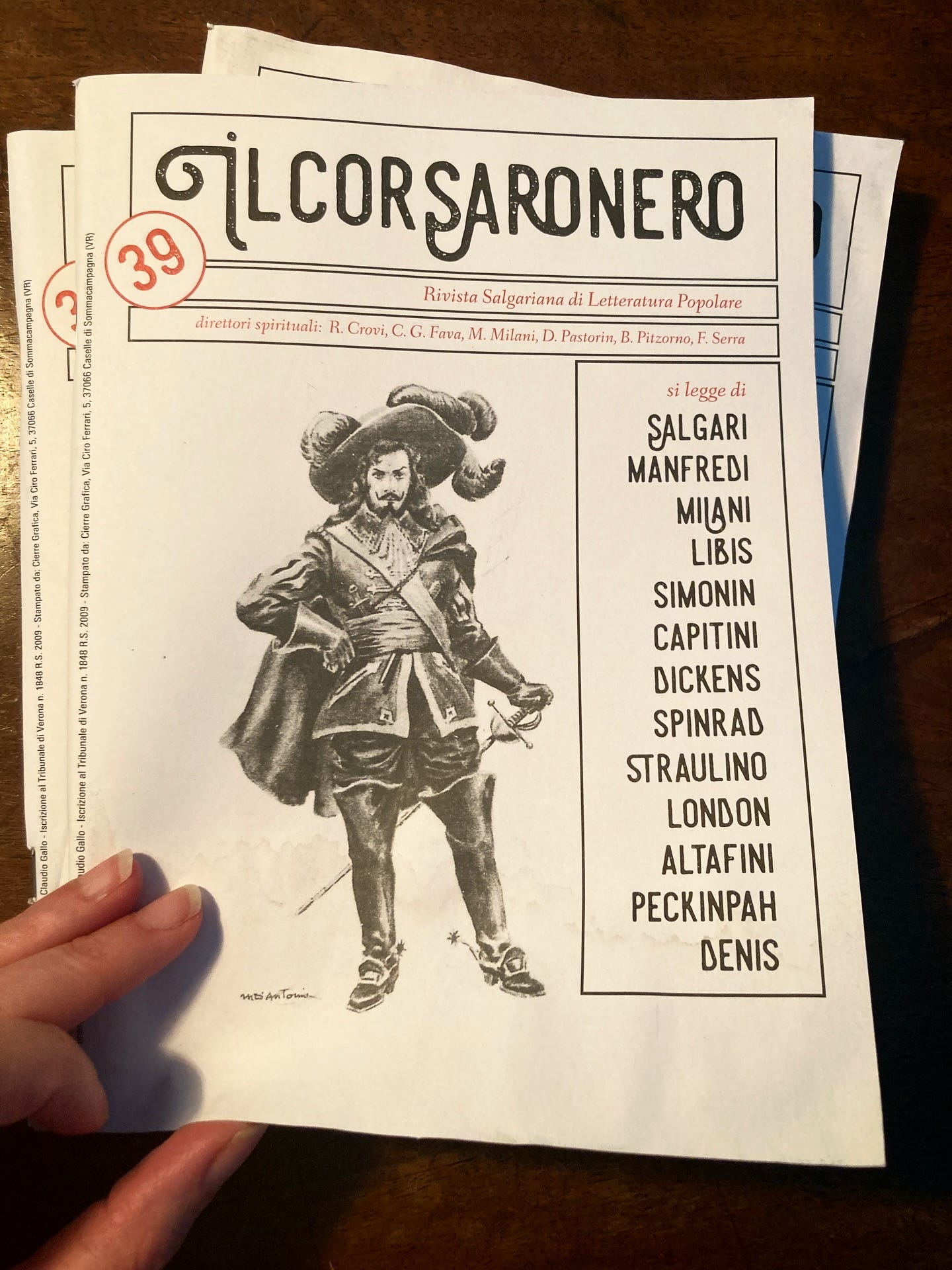 May be an image of text that says '39 ILCORSARONERO SARONERO Rivista Salgariana di Letteratura Popolare direttori spiritali: R. Crovi, C.G. የ, M. ακι, D Pastorin, B Pitzarno, Serra CIN si legge di SALGARI MANFREDI MILANI LIBIS SIMONIN CAPITINI DICKENS SPINRAD STRAULINO LONDON ALTAFINI PECKINPAH DENIS นอ MEATO ob'