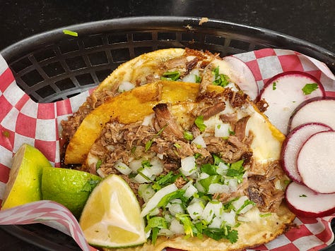 Tacos la Familia chips and salsa trio, chicken burrito, and birria tacos