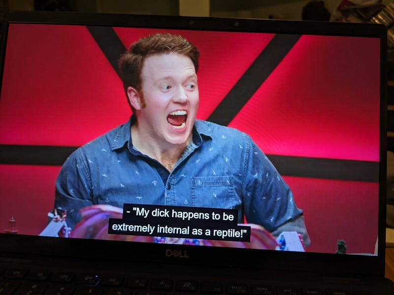 A screencap of Brennan Lee Mulligan from Dimension 20: Fantasy High, saying “My dick happens to be extremely internal as a reptile”