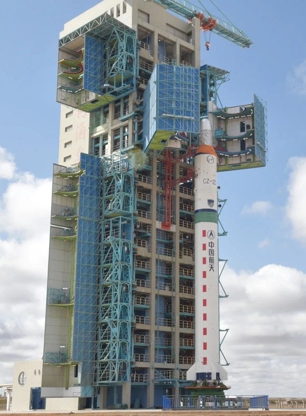 The Long March 2D vehicle during launch preparations with the Shijian-19 spacecraft attached to the second-stage ahead of fairing encapsulation.