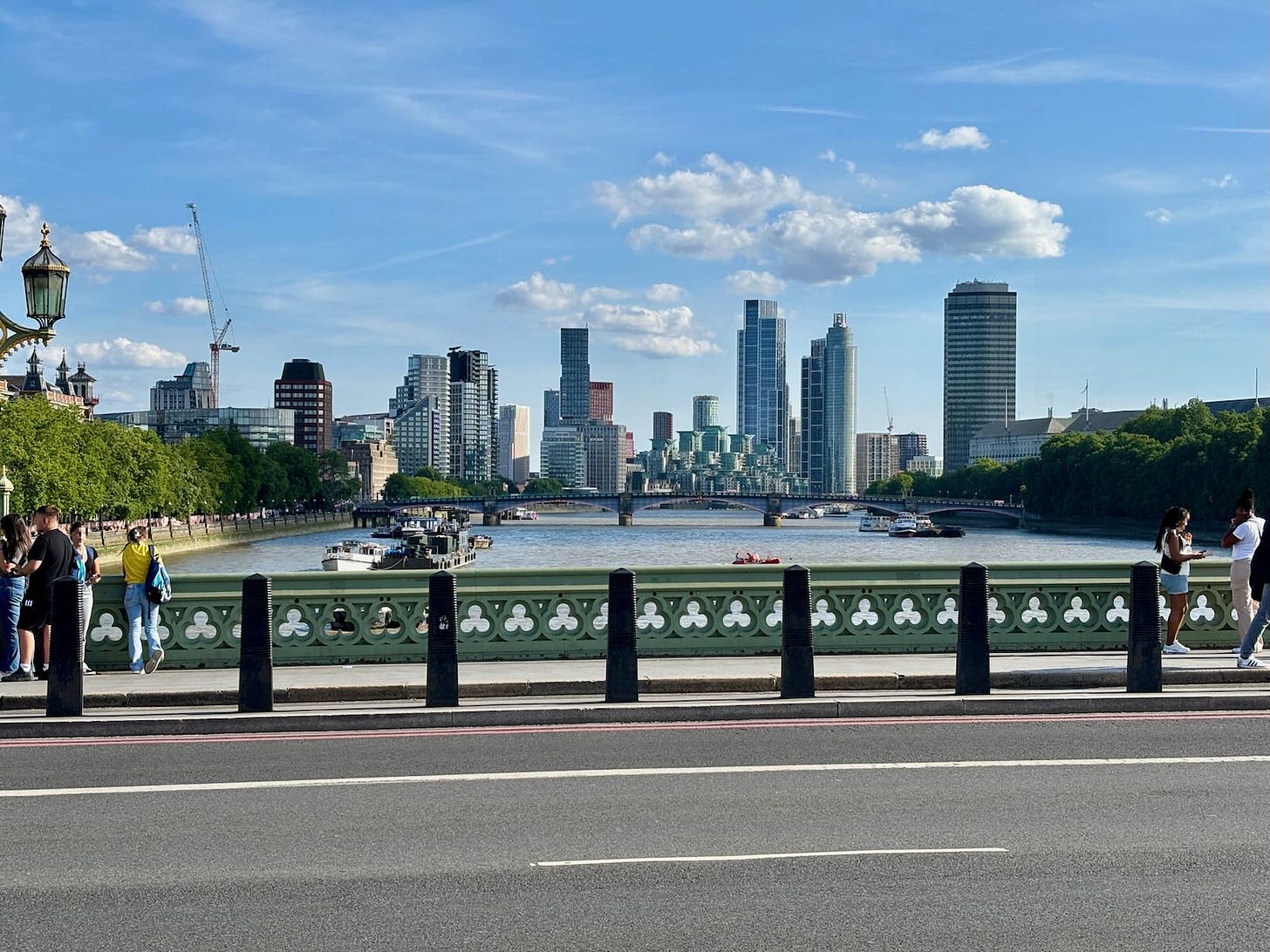 View along the River Thames showing the middle section of Westminster Bridge in the foreground and Lambeth Bridge in the distance.