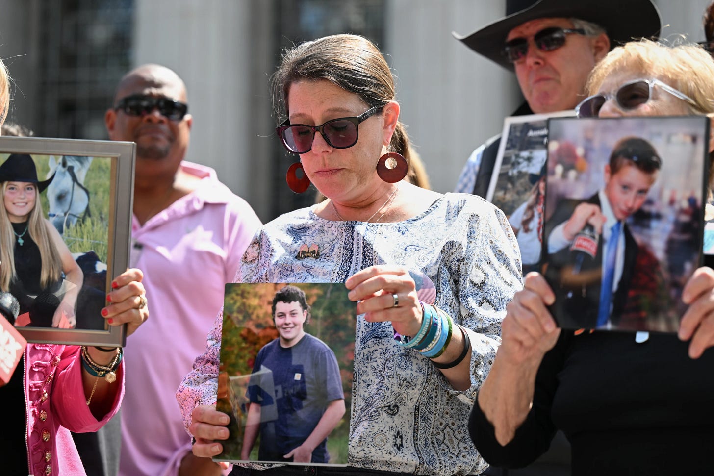 Mary Rodee holds a photo of her son Riley after the verdict in a landmark trial over whether social media platforms deliberately addict and harm children, at Los Angeles Superior Court Mary Rodee holds a photo of her son Riley after the verdict in a landmark trial over whether social media platforms deliberately addict and harm children, at Los Angeles Superior Court
