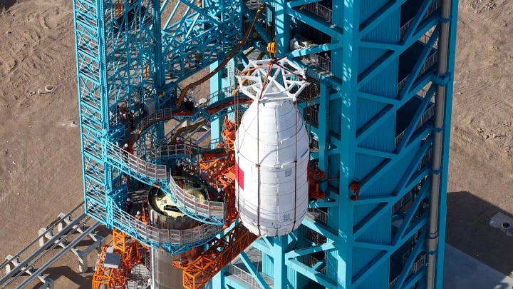 Zhuque-3 Y2's first and second stages rolling out atop of its transporter erector, and its payload fairing being placed atop of the launch vehicle.