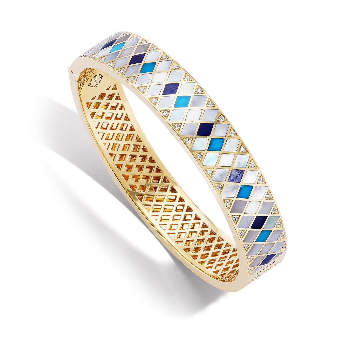the Temple Tile inlay bangle by Orly Marcel, mother of pearls, hard stones, diamonds and 18kt gold.
