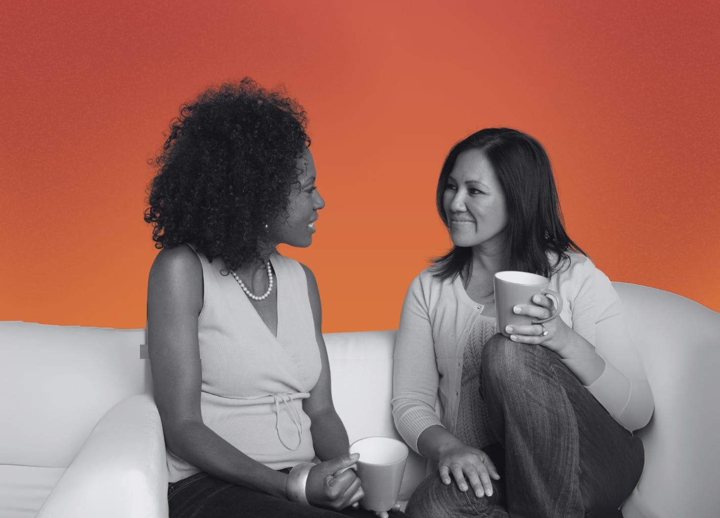 In front of a yellow sunset background, two people of diverse backgrounds are sitting and smiling as they have conversations about shared power.