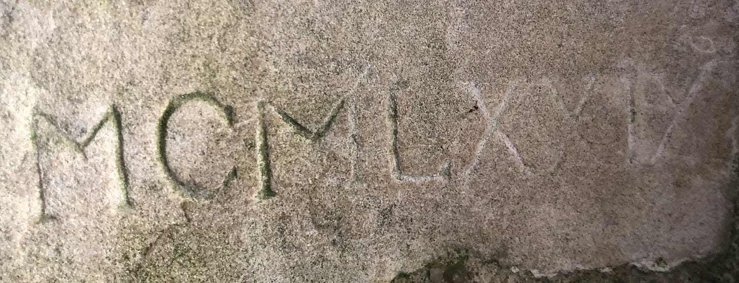 A stone with writing on it

AI-generated content may be incorrect.