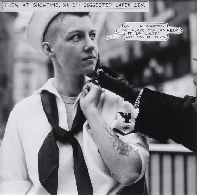A black-and-white photo shows a person wearing a sailor outfit, looking pensively to the side. A gloved hand from someone on the right holds their cheek. The tone is contemplative and informative. The caption in the top left corner says 'Then at showtime, Shi-Shi suggested safer sex.' The thought bubble next to the sailor says 'Um... A condom! I've heard you can keep it up longer with one of them.' The sailor is wearing a white hat, white shirt, and a black sailor's tie. They have a tattoo on their left arm. The arm reaching out has on a diamond bracelet, a black glove, and black sleeves.