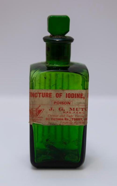 Green glass bottle Tincture of iodine poison tagged {{PD-US-expired}} Green glass bottle Tincture of iodine poison tagged {{PD-US-expired}}